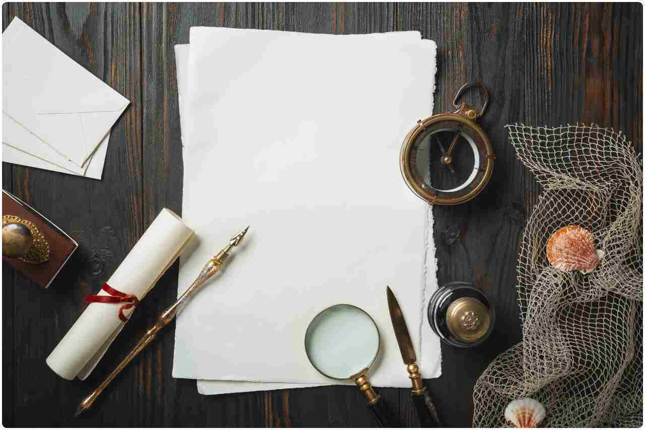 Blank sheet of white paper on a dark wooden background